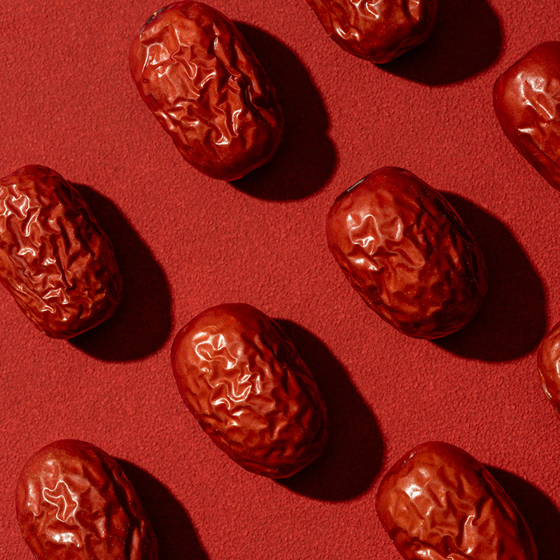 Jujube fruits on a red background